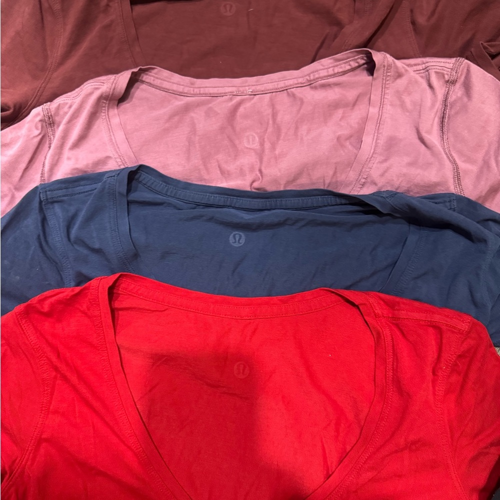Lulu bundle. All size 2. Four V-Necks, one crew w sleeves, one crew sleeveless.